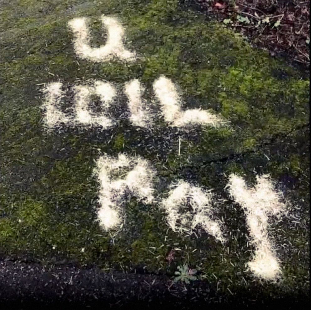 PHOTO: Racist anti-China graffiti messages were written with hay in large block letters in the parking lot of the International Full Gospel Fellowship Church in Seattle. The phrases included expletives and spelled out the message "CHINA, YOU WILL PAY."