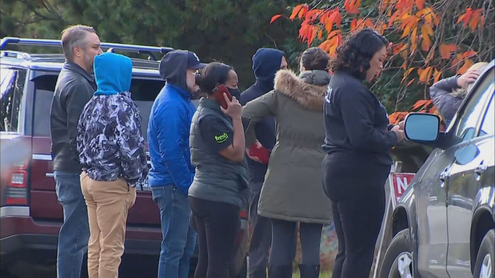 PHOTO: People standing at the scene of a school shooting in Seattle on Nov. 8, 2022.