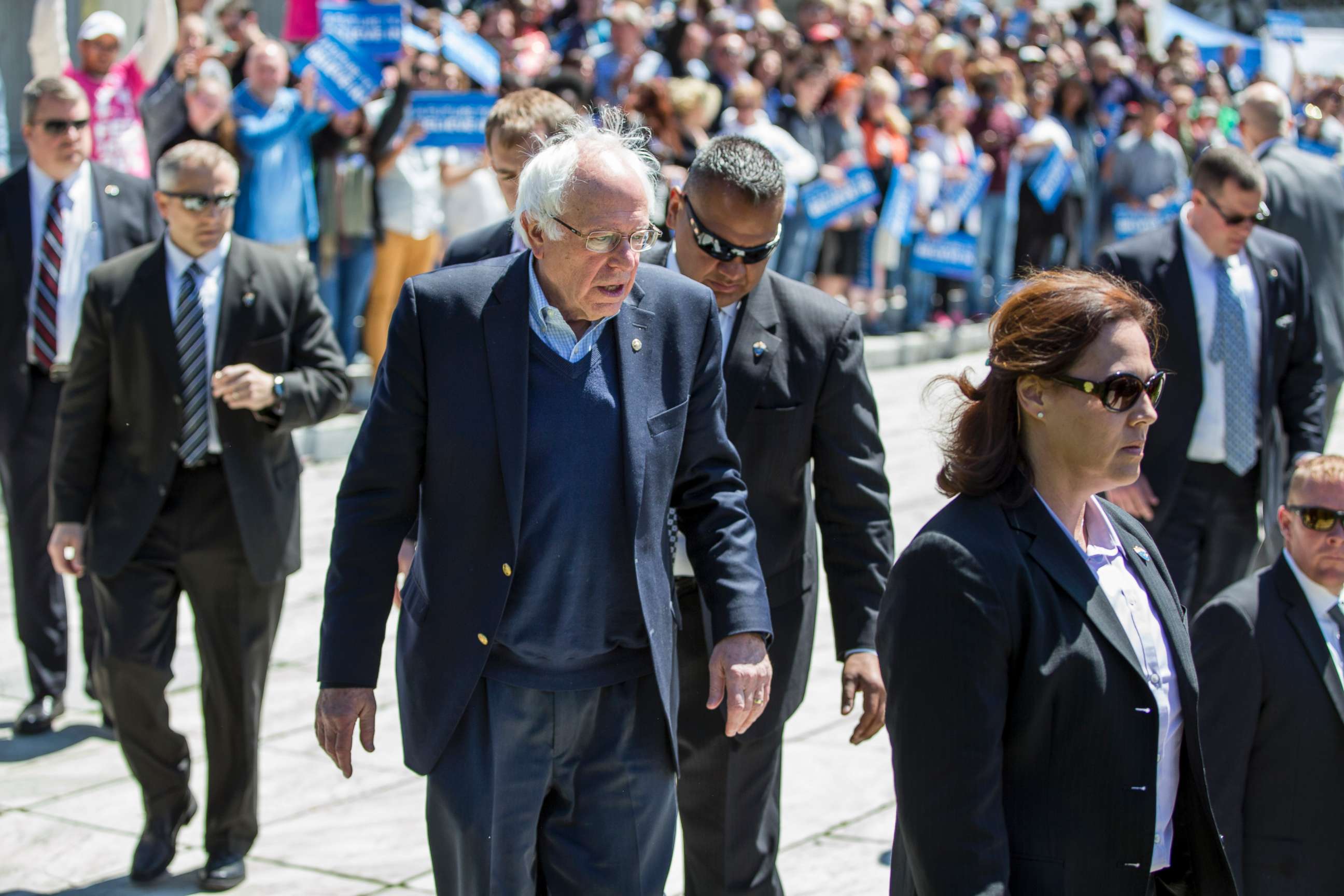 PHOTO: Democratic presidential candidate, U.S. Sen. Bernie Sanders is flanked by his Secret Service detail before greeting supporters following a rally at Roger Williams Park on April 24, 2016 in Providence, Rhode Island. 