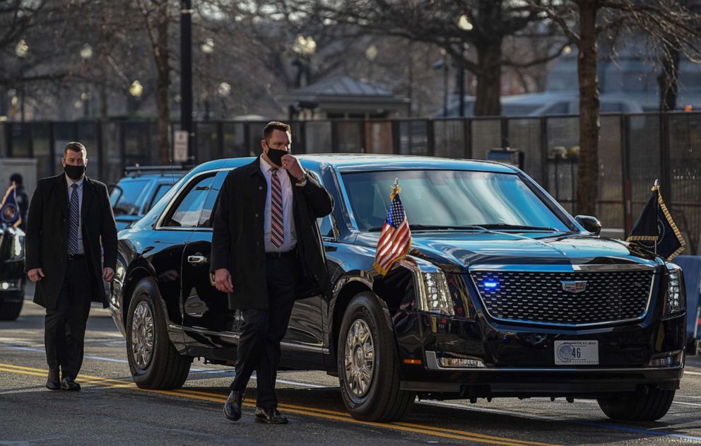 PHOTO: Secret Service members walk along side the Presidential Motorcade during the Inauguration Day parade for Joe Biden and Kamala Harris in Washington, D.C., Jan. 20, 2021.