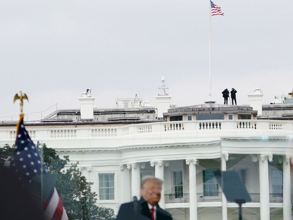 PHOTO: Members of the Secret Service patrol from the roof of the White House as President Donald Trump speaks to supporters from The Ellipse in Washington, DC, Jan. 6, 2021.