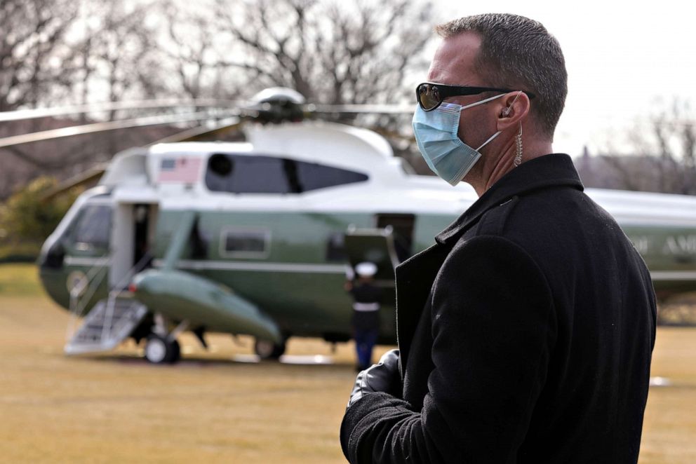 PHOTO: A U.S. Secret Service agent stands guard near Marine One with President Joe Biden and first lady Jill Biden aboard on the South Lawn of the White House, Feb. 26, 2021, in Washington.