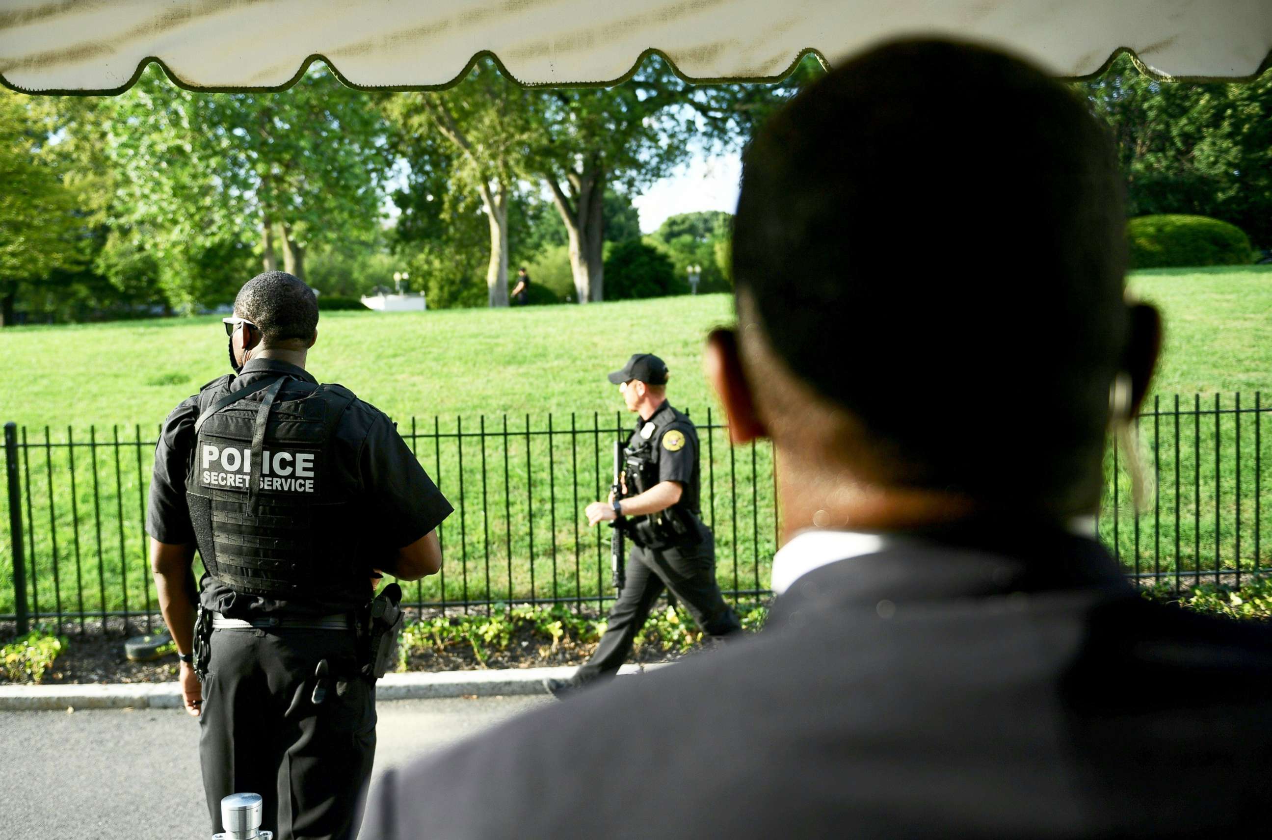 PHOTO: Members of the Secret Service take up position outside the Brady Briefing Room as the White House is locked down in Washington, DC, on Aug. 10, 2020.
