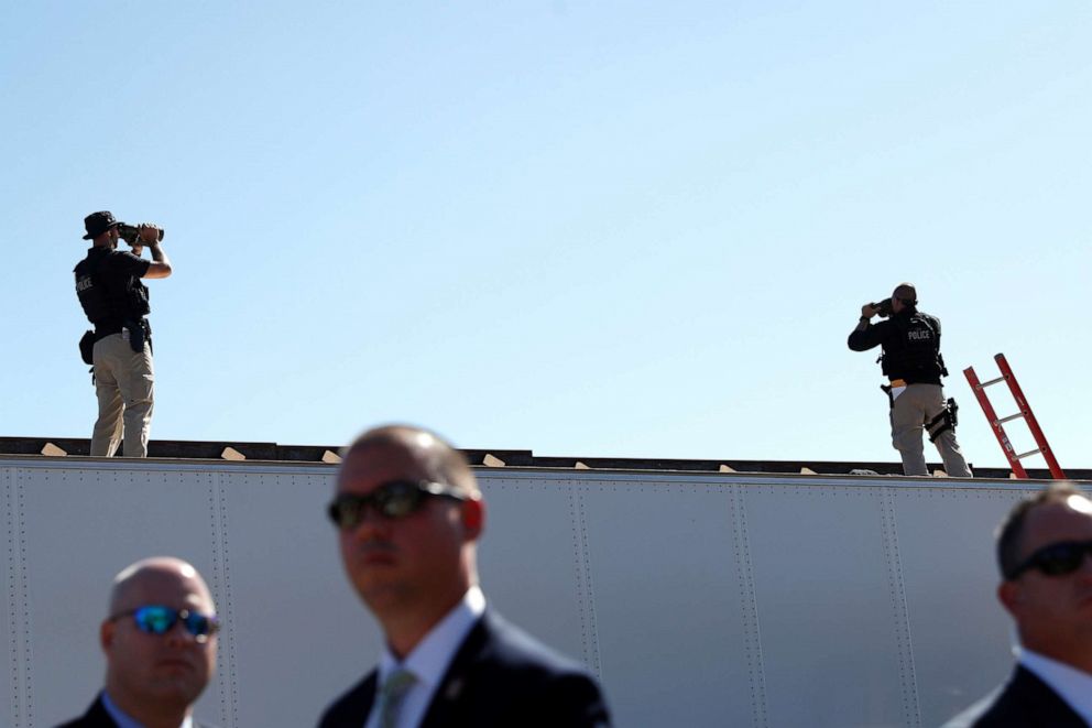 PHOTO: United States Secret Service Agents scan the surrounding area of the international border during President Donald Trump's visit to a section of the U.S.-Mexico border wall in Otay Mesa, Calif., Sept. 18, 2019.  