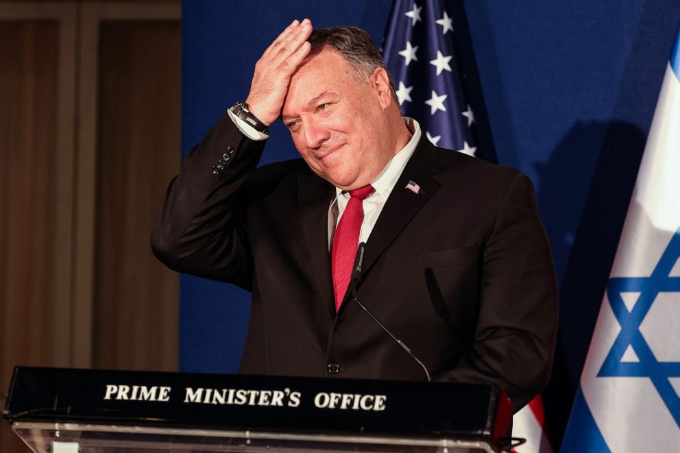 PHOTO: US Secretary of State Mike Pompeo pats his head during a press conference with the Israeli Prime Minister and Bahrain's Foreign Minister after their trilateral meeting in Jerusalem on Nov. 18, 2020. 