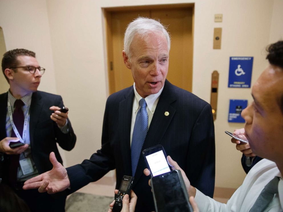 PHOTO: Sen. Ron Johnson, R-Wis. responds to reporters as he and other Senators arrive for weekly policy meetings on Capitol Hill in Washington, July 11, 2017.