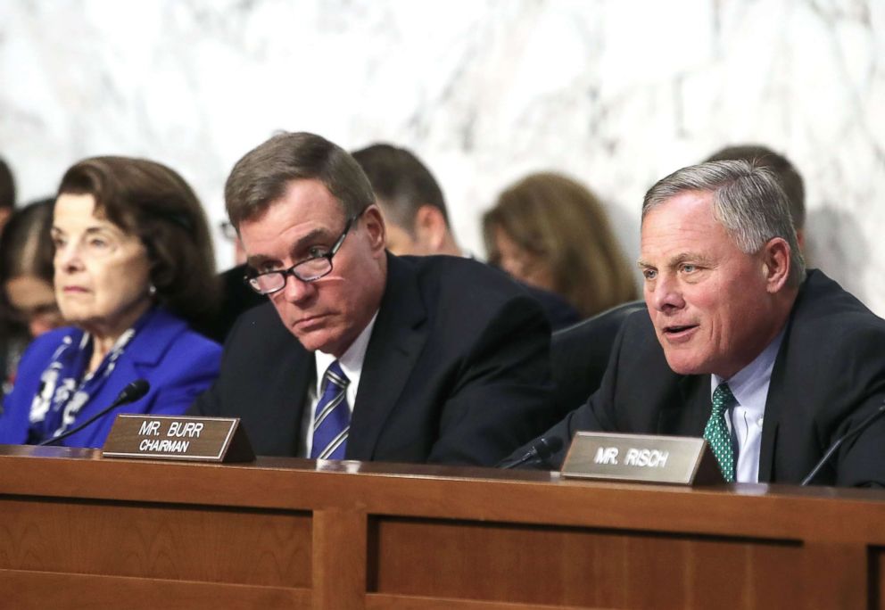 PHOTO: Chairman Richard Burr (R), speaks while flanked by ranking member Sen. Mark Warner (C), and Sen. Dianne Feinstein, during a Senate Intelligence Committee hearing, on Capitol Hill August 1, 2018 in Washington, D.C.