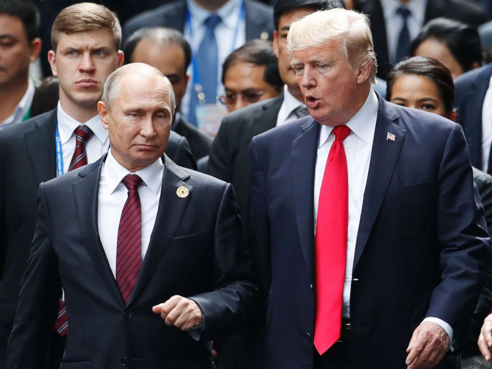 PHOTO: President Donald Trump and Russias President Vladimir Putin talk during the family photo session at the APEC Summit in Danang, Vietnam, Nov. 11, 2017.