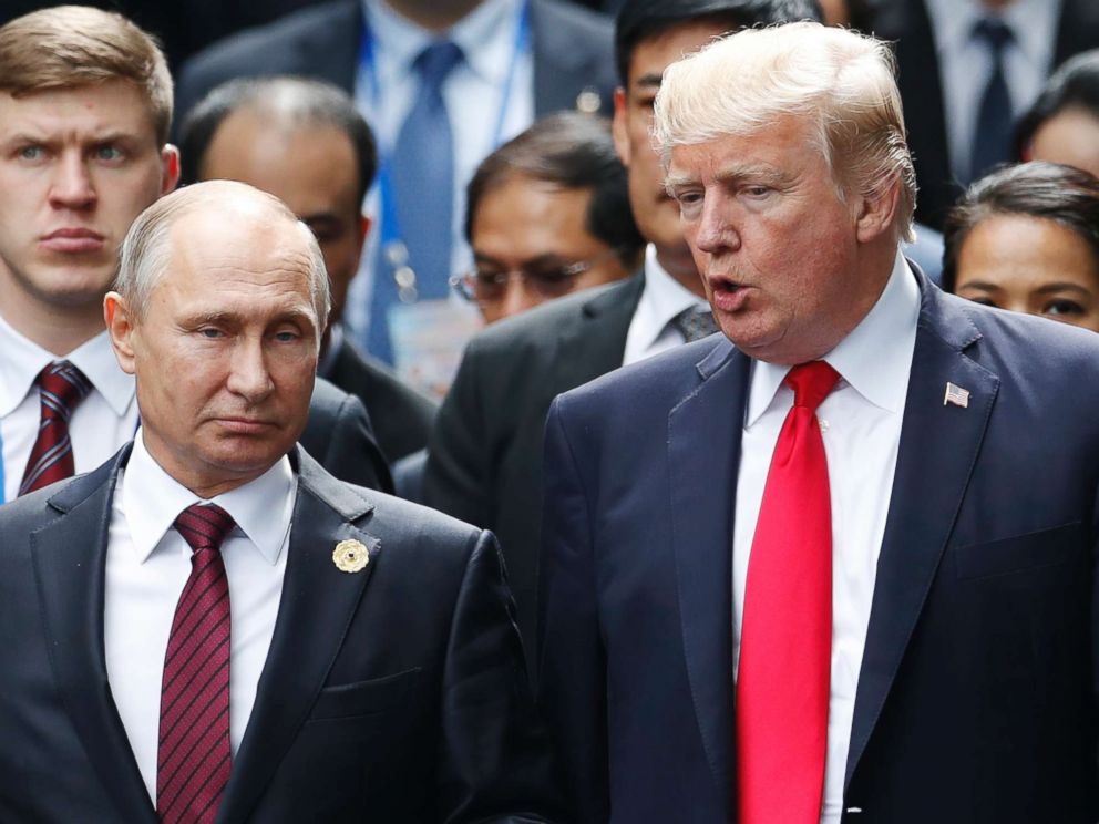 PHOTO: President Donald Trump and Russia's President Vladimir Putin talk during the family photo session at the APEC Summit in Danang, Vietnam, Nov. 11, 2017. 