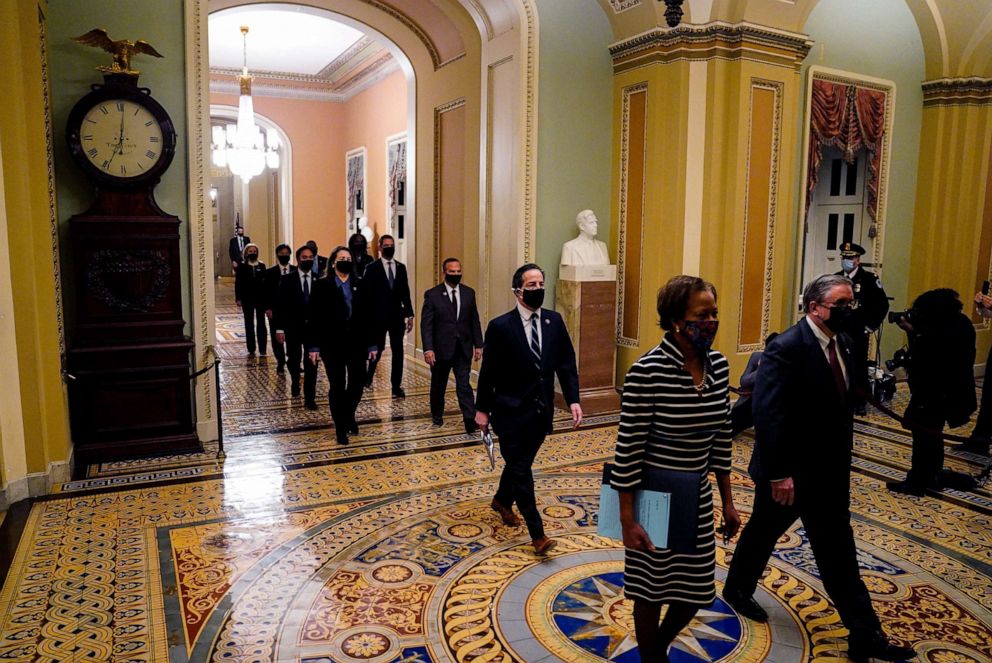 PHOTO: House Clerk Cheryl L. Johnson and acting House sergeant-at-arms Timothy P. Blodgett lead House impeachment managers to deliver an article of impeachment against former President Donald Trump to the Senate, on Jan. 25, 2021, in Washington, D.C.