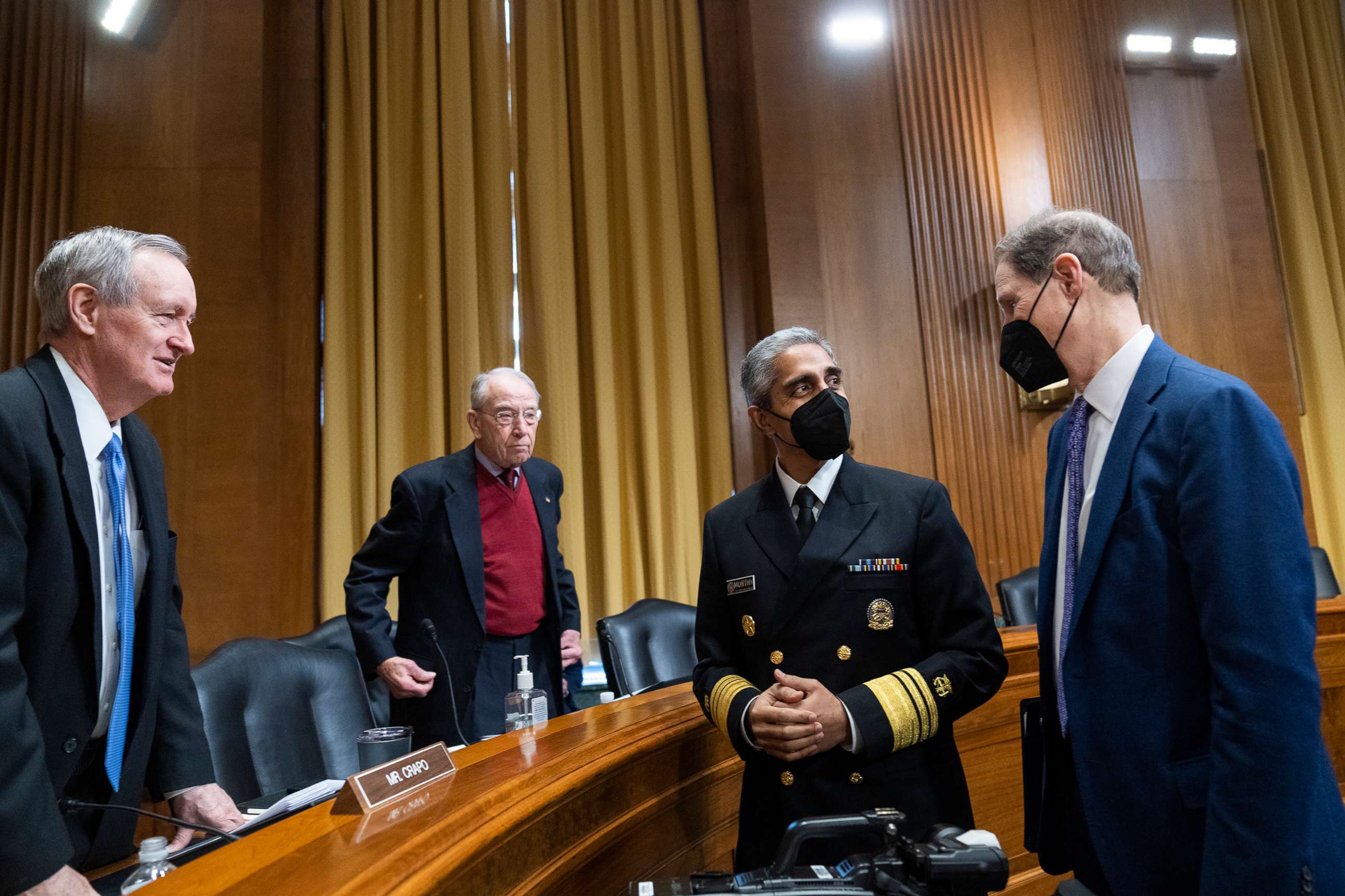 PHOTO: In this Feb. 8, 2022, file photo, from right, Chairman Ron Wyden, Surgeon General Vivek H. Murthy, Sen. Chuck Grassley, and Ranking member Sen. Mike Crapo, talk before the Senate Finance Committee hearing titled Protecting Youth Mental Health.