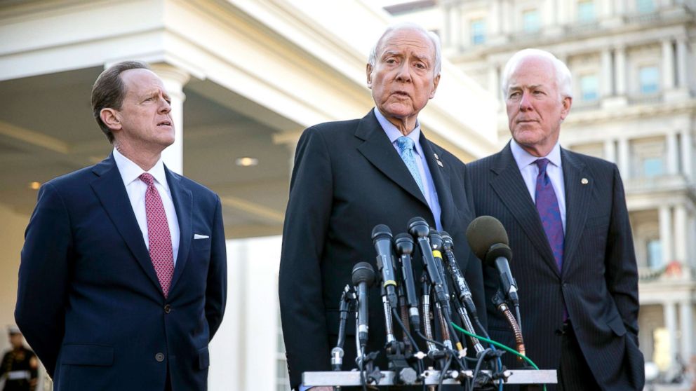 Senate Finance Committee Chairman Orrin Hatch (C), with Senate Finance Committee Republican members John Cornyn (R) and Patrick Toomey (L) delivers remarks to the news media after a meeting on tax reform in Washington DC, Nov. 27, 2017.