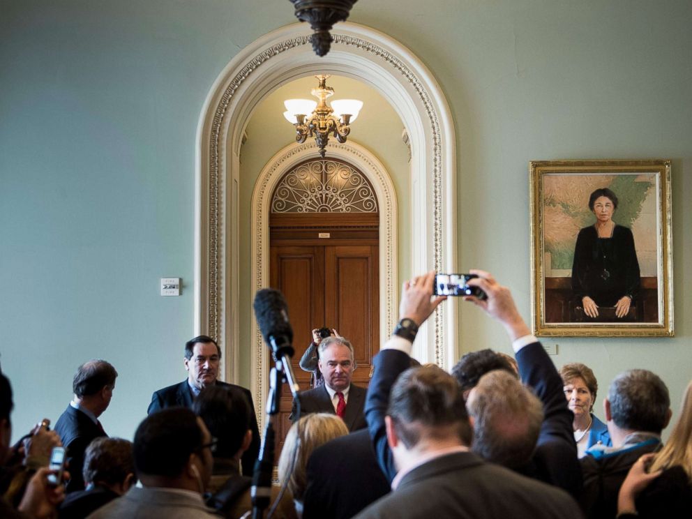 PHOTO: Senator Tim Kaine waits to speak to a reporter on Capitol Hill after the Senate voted to fund the US government, Jan. 22, 2018 in Washington.