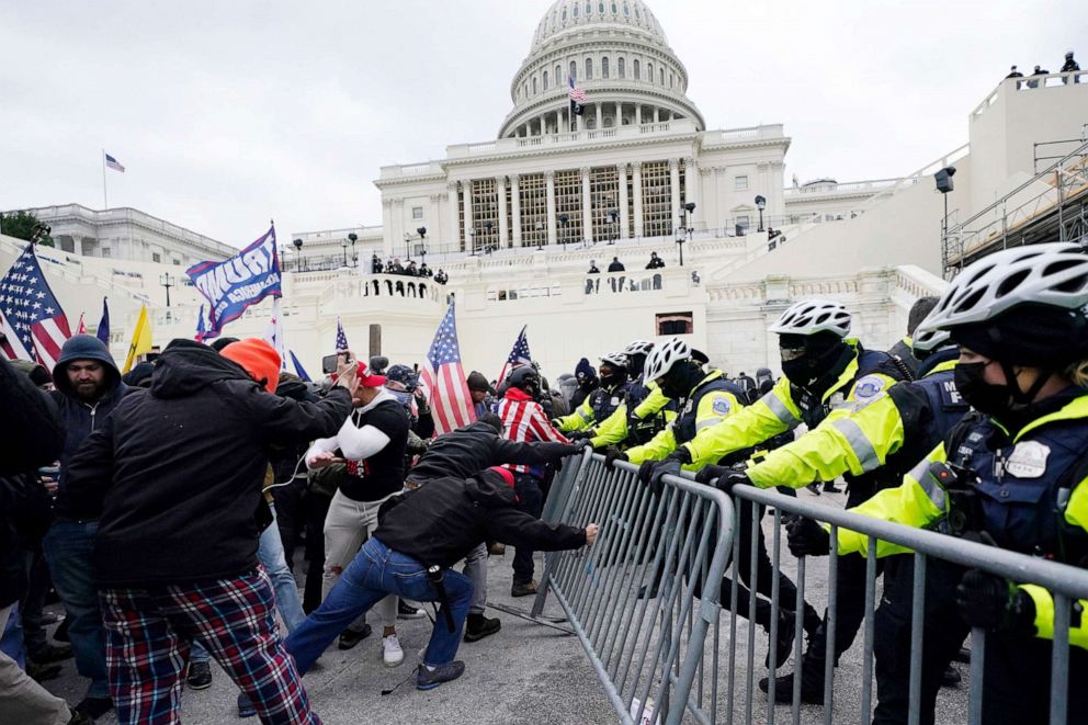 PHOTO: Trump supporters try to break through a police barrier outside the Capitol in Washington, Jan. 6, 2021.