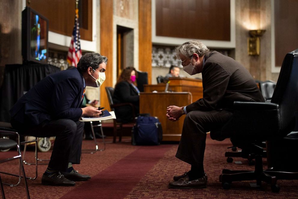 PHOTO: Sen. John Kennedy, right, speaks to a staffer during a Senate Judiciary Committee confirmation hearing on the nomination of Judge Justin Walker to be a circuit court judge for the District of Columbia on Capitol Hill in Washington, May 6, 2020.
