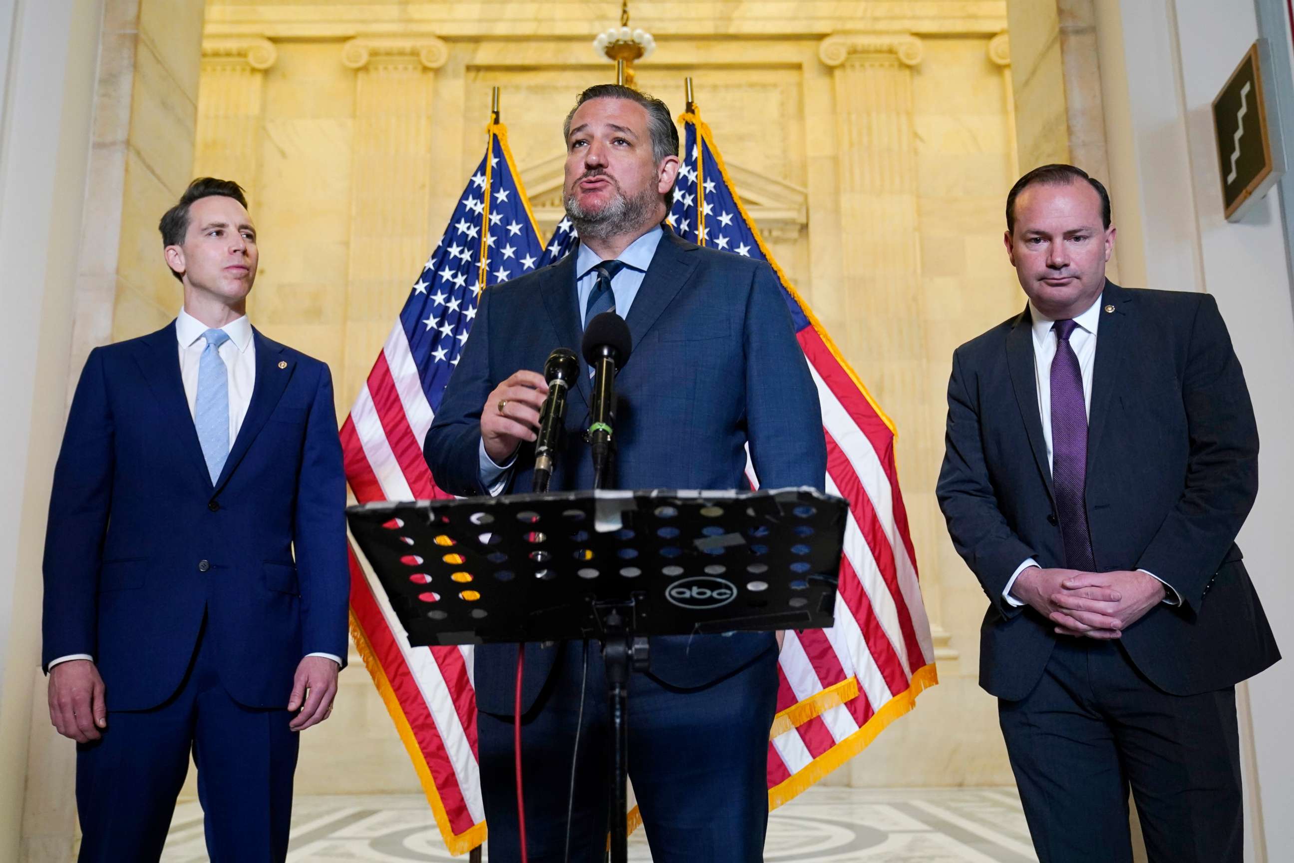 PHOTO: Sen. Ted Cruz, R-Texas, center, flanked by Sen. Josh Hawley, R-Mo., left, and Sen. Mike Lee, R-Utah, right, talks about legislation to end Major League Baseball's special immunity from antitrust laws, during a news conference on April 13, 2021. 