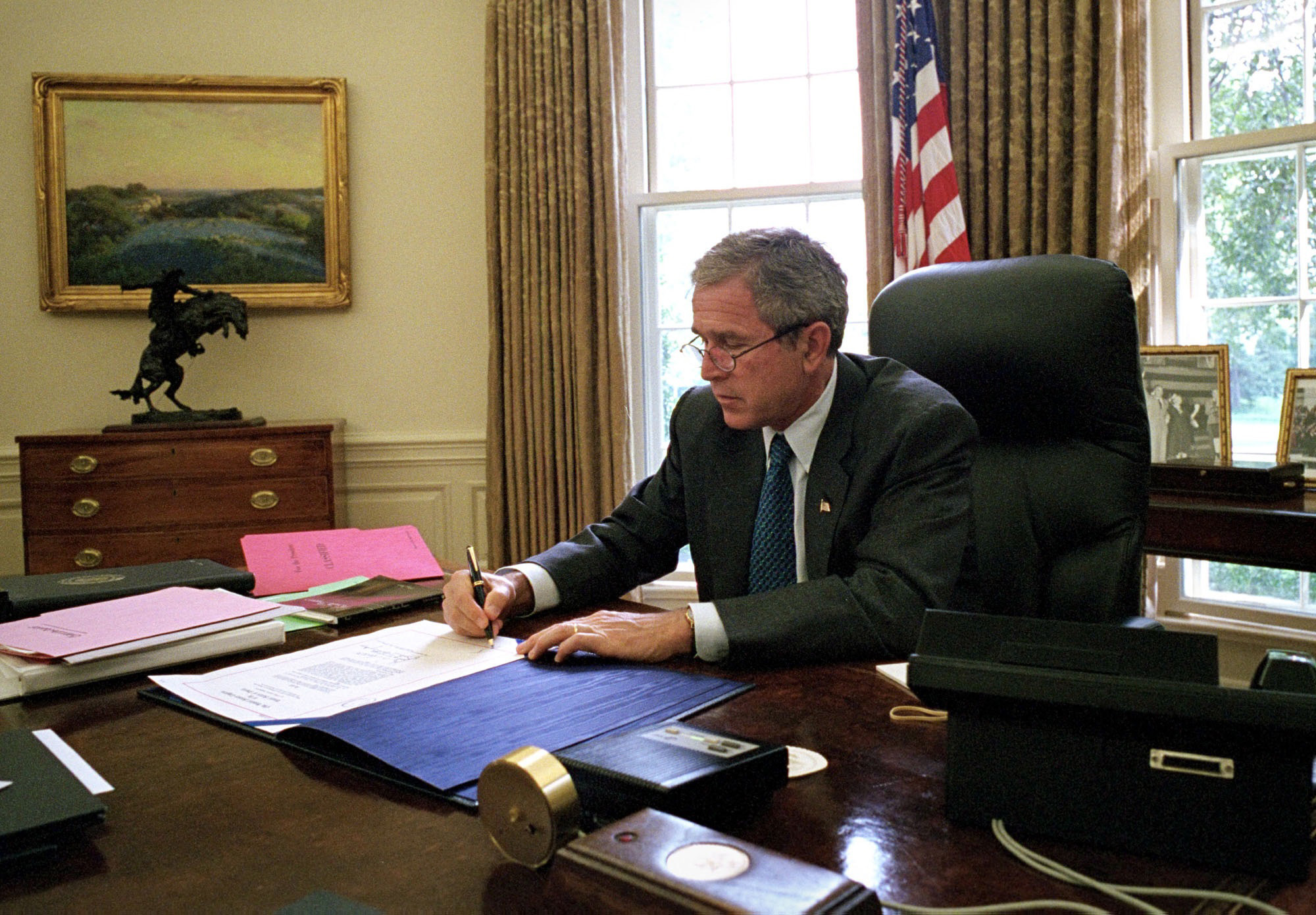PHOTO: President George W. Bush signs a document that makes additional assistance available to the state of New York following the attacks on the World Trade Center in the White House in Washington, Sept. 18, 2001.