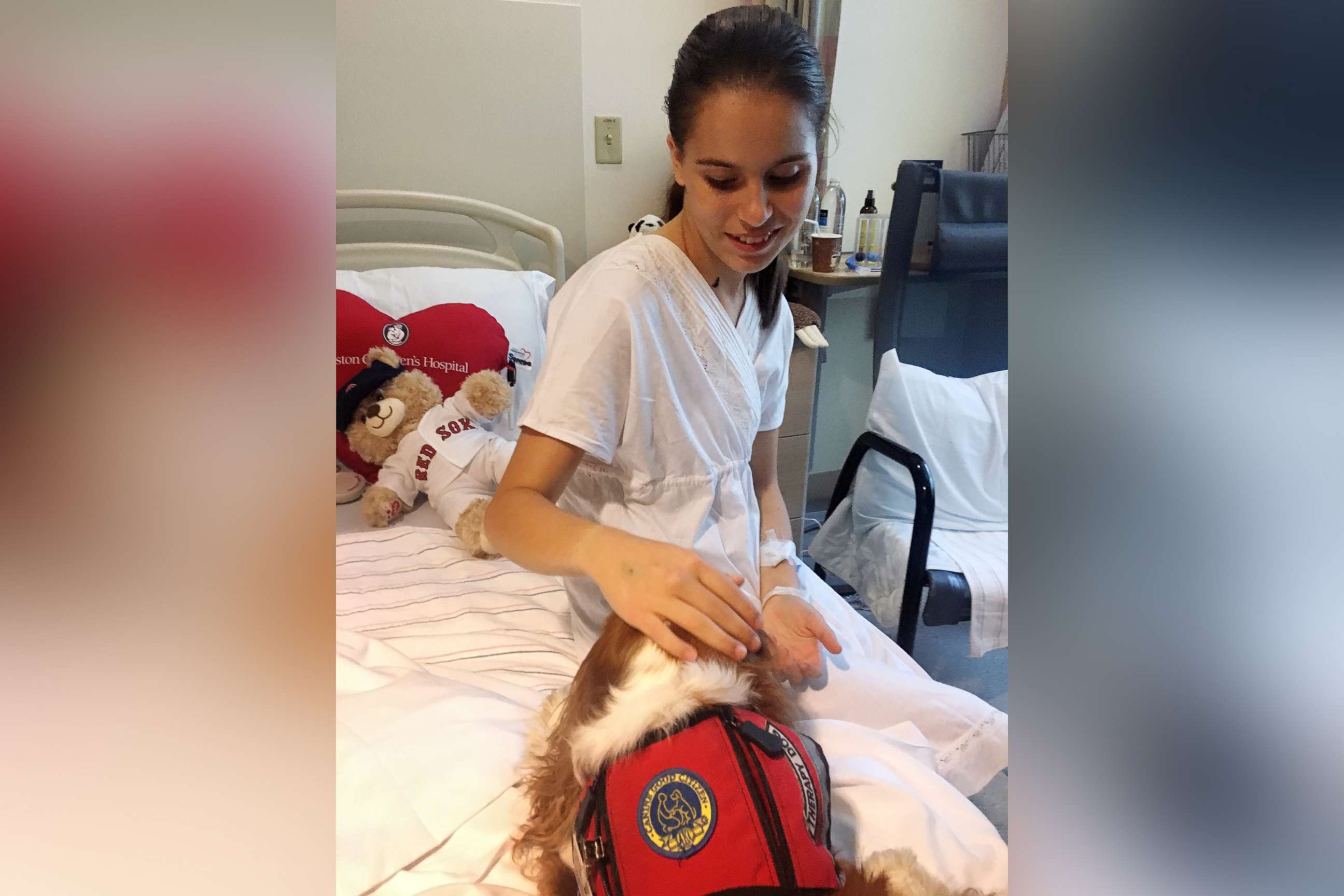 PHOTO: Serena Badia sits on a hospital bed between procedures for her congenital heart condition at a Boston children's hospital.