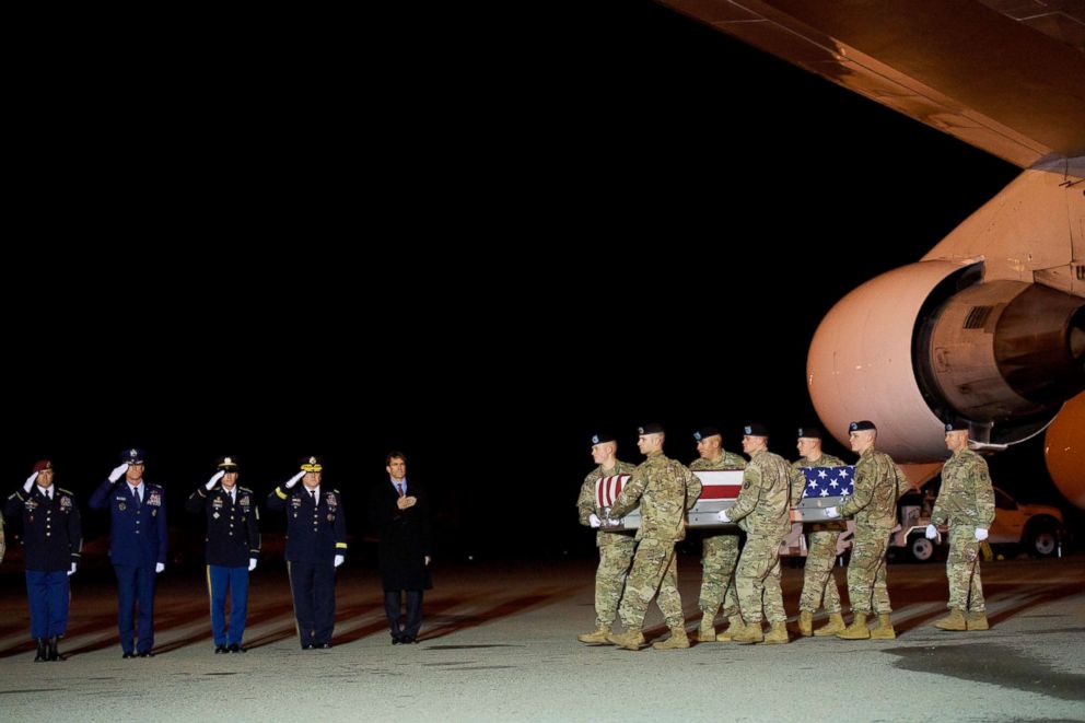 PHOTO: Armed forces carry a transfer case covered with an American flag during a dignified transfer for fallen service member Sergeant Leandro A.S. Jasso, Nov. 27, 2018, in Dover, Del.