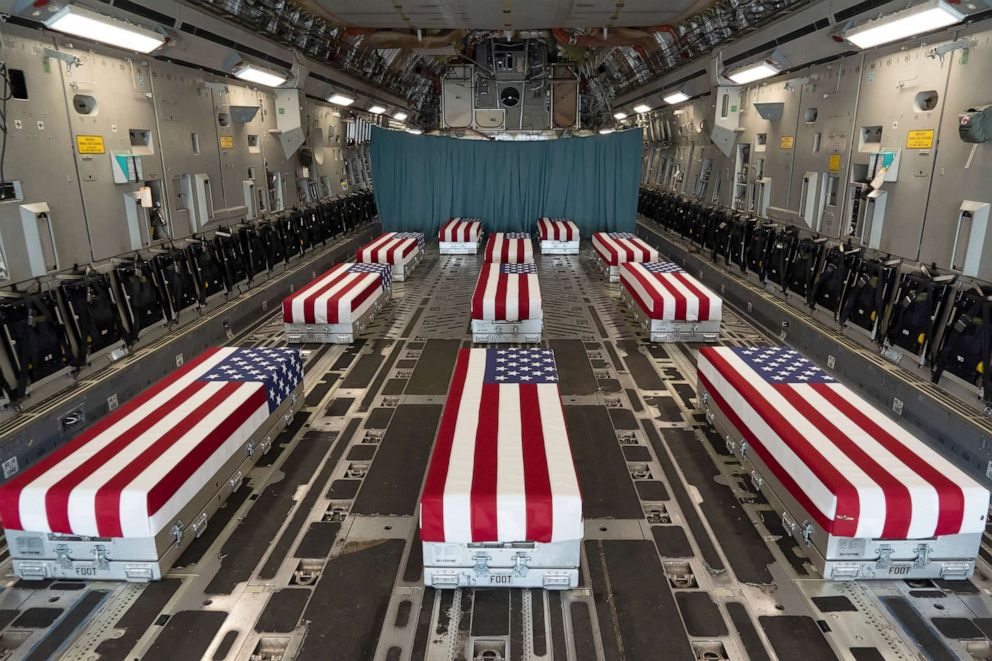 PHOTO: Flag-draped transfer cases line the inside of a transport plane, Aug. 29, 2021, prior to a dignified transfer at Dover Air Force Base, Del.