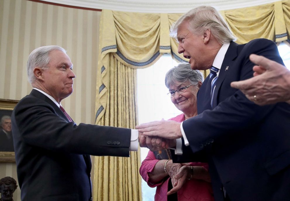 PHOTO: President Donald Trump shakes the hand of Jeff Sessions after he was sworn in as the new U.S. Attorney General in the Oval Office of the White House, Feb. 9, 2017.