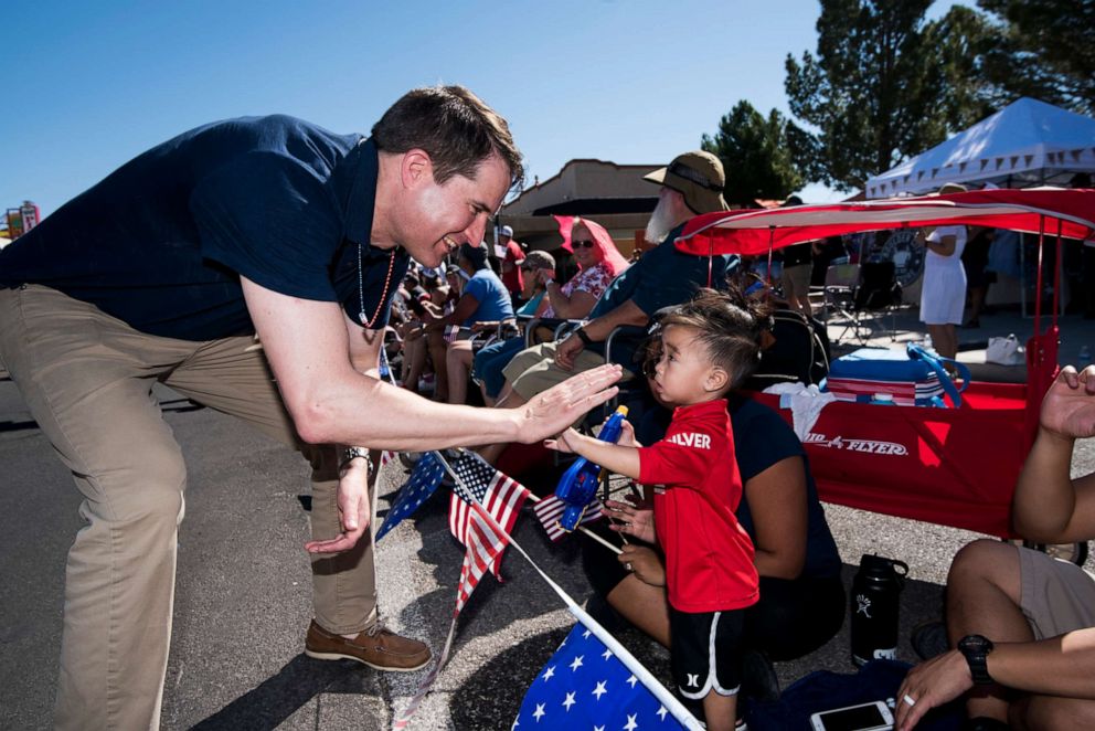 PHOTO: Presidential candidate Rep. Seth Moulton gives a high five to a spectator during the Boulder City Damboree Celebration 4th of July parade in Boulder City, Nev., on July 4, 2019.