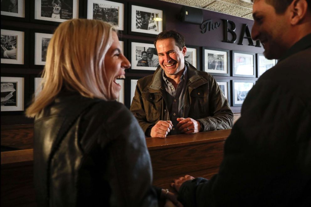 PHOTO: Rep. Seth Moulton meets with patrons after participating in the Pints and Politics event held at The Barley House in Concord, N.H., March 16, 2019.