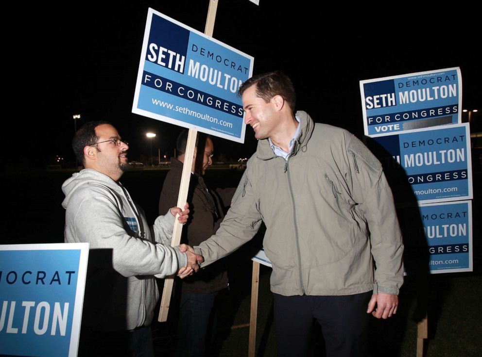 PHOTO: Seth Moulton, right, greets supporter Philip D'Agaati outside North Andover High School in North Andover, Mass., Nov. 4, 2014.