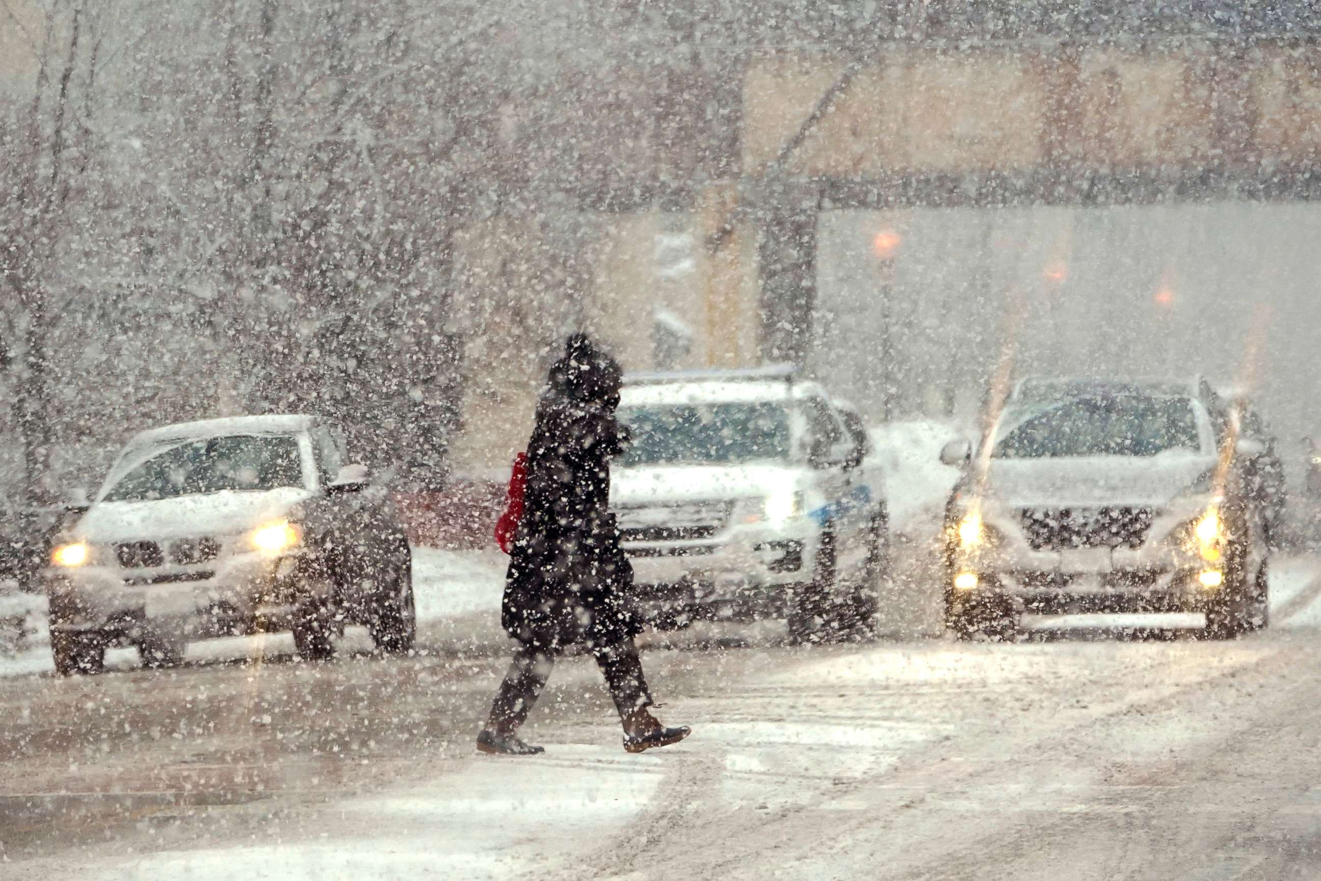 PHOTO: A lone pedestrian crosses Michigan Ave. in a snow storm Thursday, Feb. 4, 2021 in Chicago.  The storm will increase already high snow totals and usher in sub-freezing temperatures behind it in the greater Chicago area.