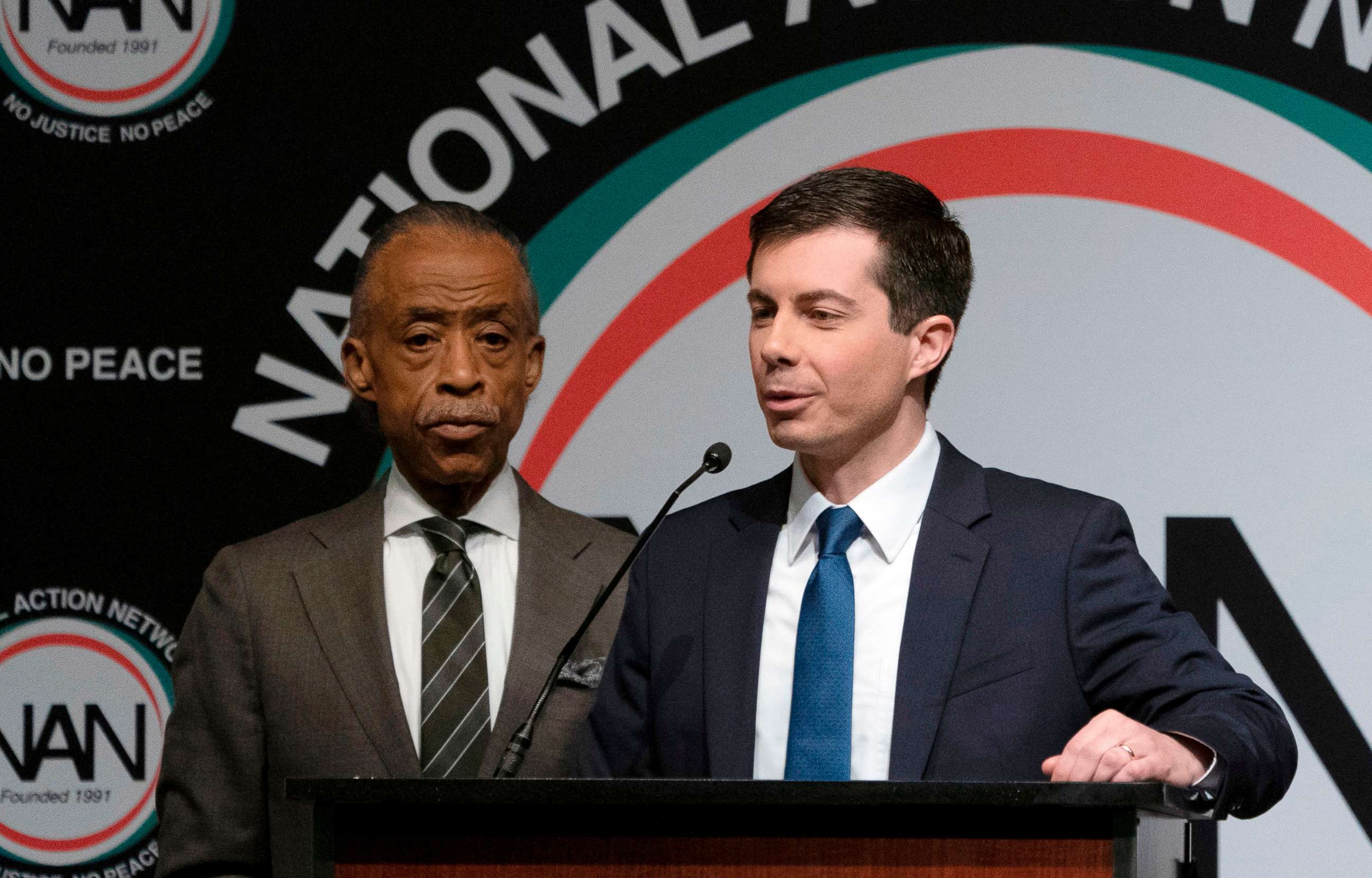 PHOTO: Democratic Presidential candidate Pete Buttigieg, with the Reverend Al Sharpton, speaks during a gathering of the National Action Network, April 4, 2019, in N.Y.