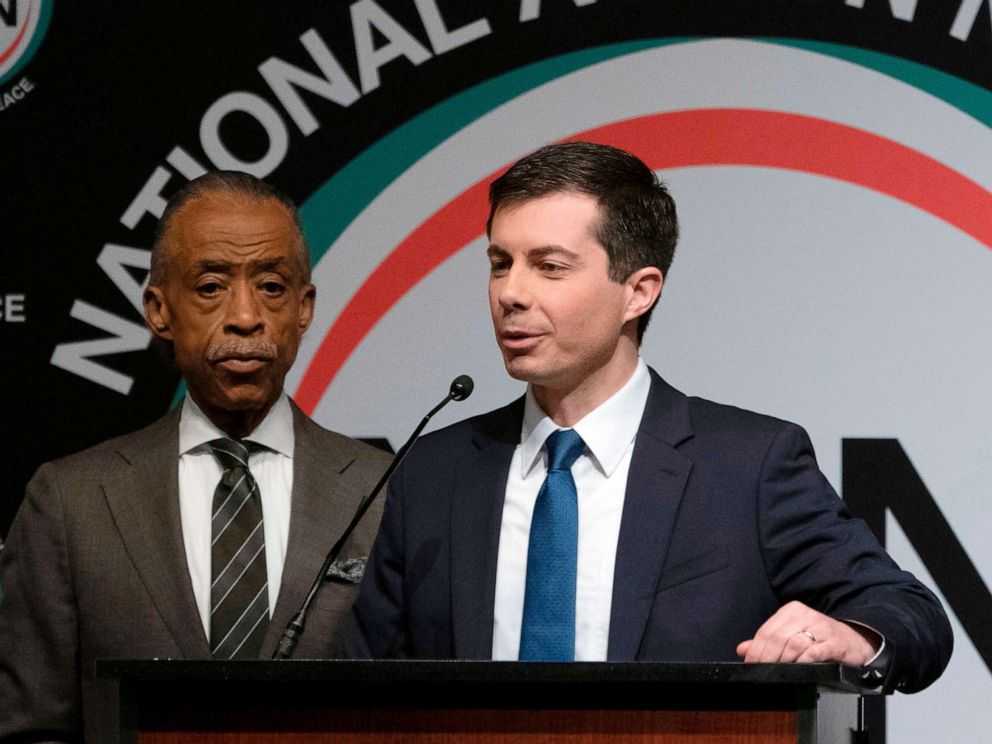 PHOTO: Democratic Presidential candidate Pete Buttigieg, with the Reverend Al Sharpton, speaks during a gathering of the National Action Network, April 4, 2019, in N.Y.