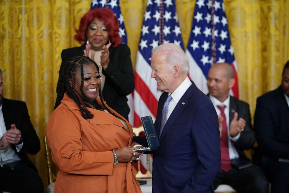 PHOTO: US President Joe Biden awards the Presidential Citizens Medal to Fulton County, Georgia, election worker Shaye Moss, during a ceremony in the East Room of the White House in Washington, DC, Jan. 6, 2023.
