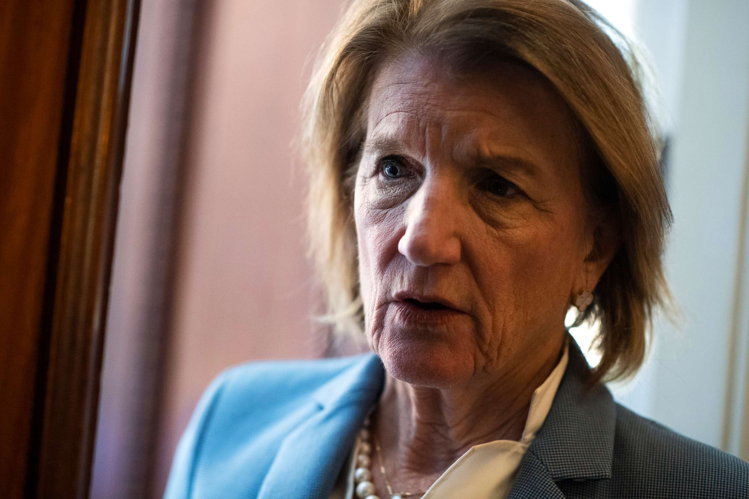 PHOTO: Sen. Shelley Moore Capito talks with reporters in the Capitol during a vote, May 25, 2021.