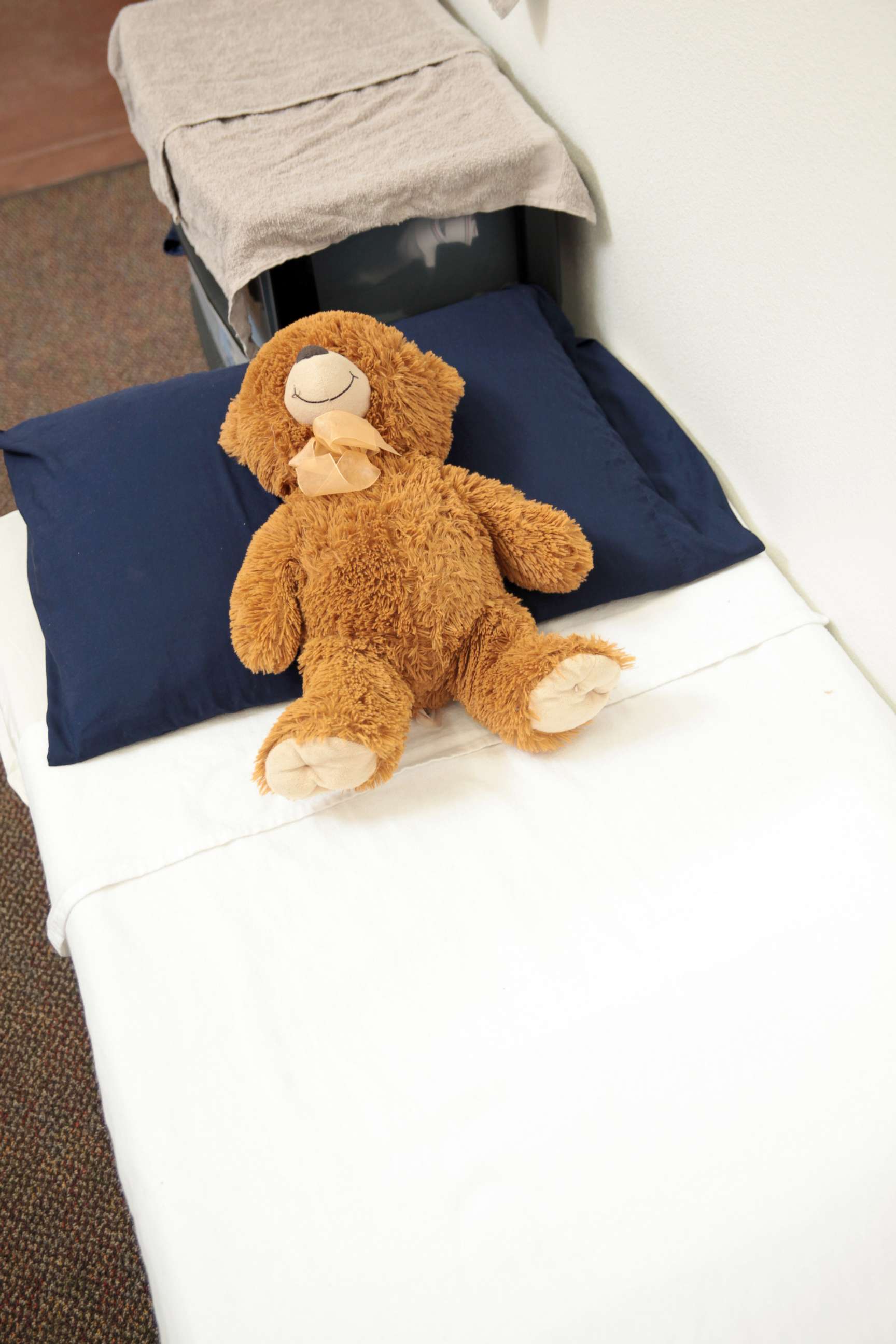 PHOTO: A teddy bear on a bed of a Walmart-turned-shelter that houses almost 1,500 undocumented children.
