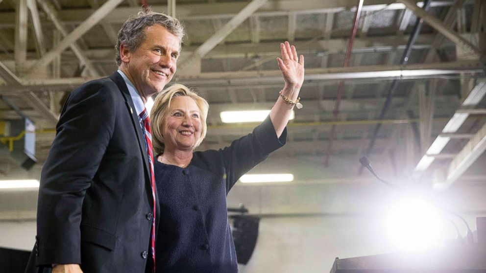 PHOTO: Democratic presidential candidate Hillary Clinton waves to supporters as she stands on stage with Sen. Sherrod Brown, D-Ohio, left, after speaking at a rally in Cleveland, June 13, 2016.