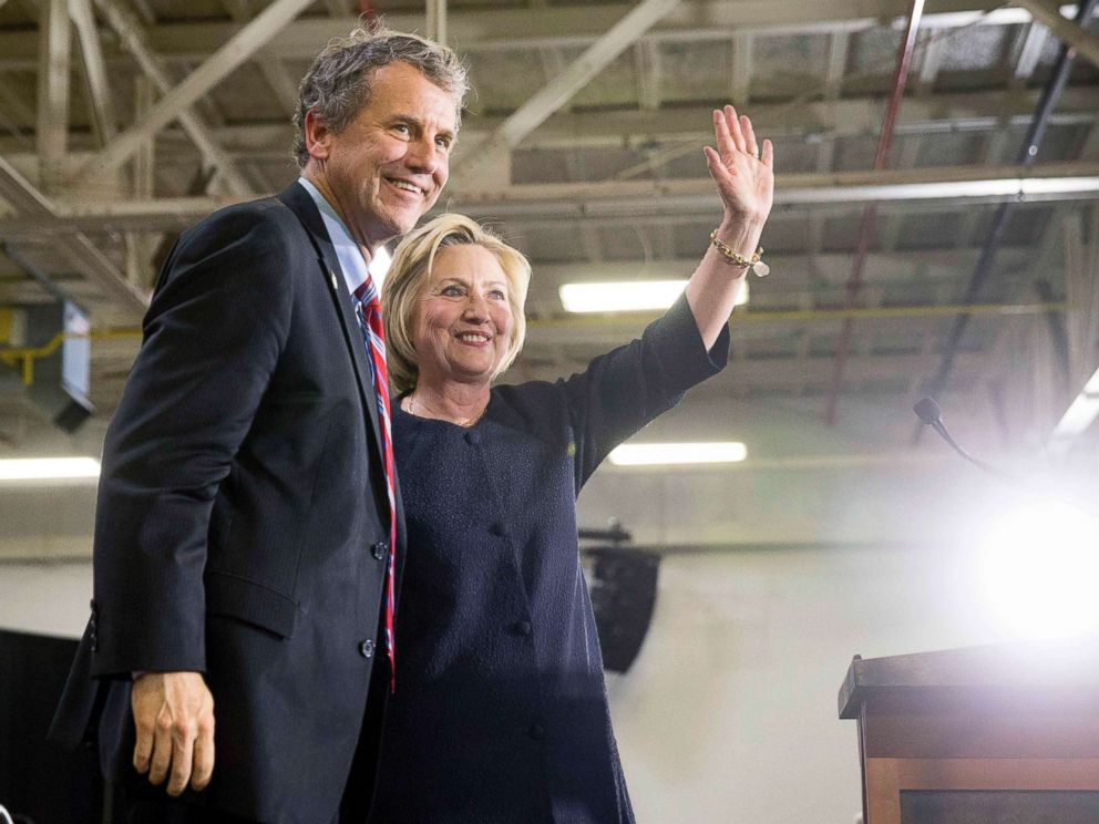 PHOTO: Democratic presidential candidate Hillary Clinton waves to supporters as she stands on stage with Sen. Sherrod Brown, D-Ohio, left, after speaking at a rally in Cleveland, June 13, 2016.