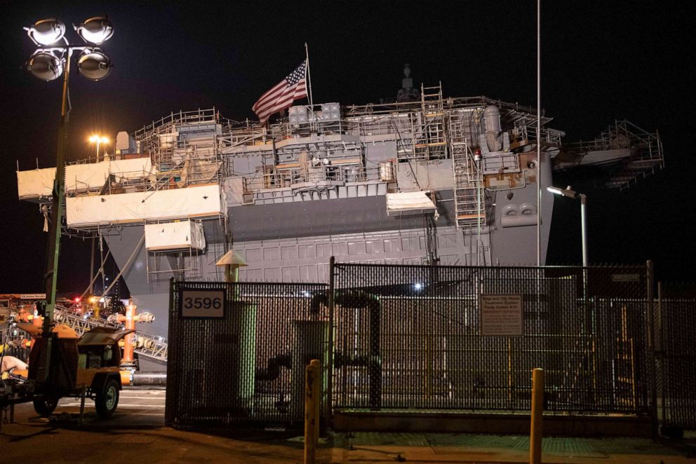 PHOTO: The American flag flies aboard the amphibious assault ship USS Bonhomme Richard (LHD 6) as damage control efforts continue aboard the ship.