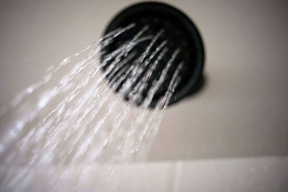 PHOTO: Water flows from a shower head, Aug. 12, 2020, in Portland, Ore. The Trump Administration wants to change the definition of a showerhead to let more water flow. 