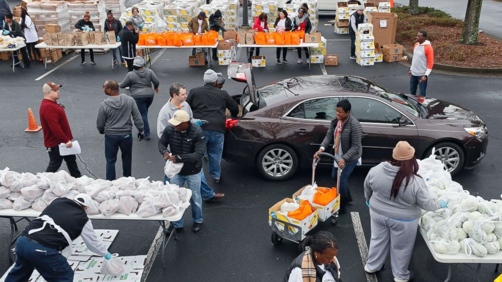 PHOTO: Employees from the TSA and Customs and Border Protection and their families waited in line for about an hour for groceries from the Atlanta Community Food Bank and Antioch Baptist Church, Jan. 18, 2019, in Hapeville, Ga.