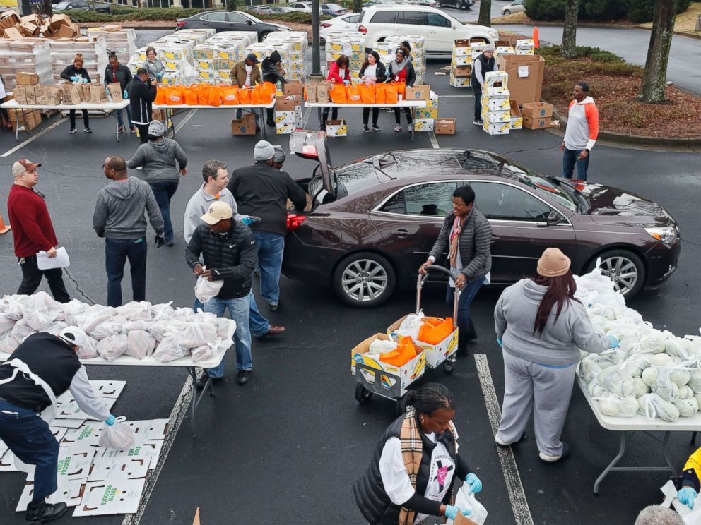 PHOTO: Employees from the TSA and Customs and Border Protection and their families waited in line for about an hour for groceries from the Atlanta Community Food Bank and Antioch Baptist Church, Jan. 18, 2019, in Hapeville, Ga.