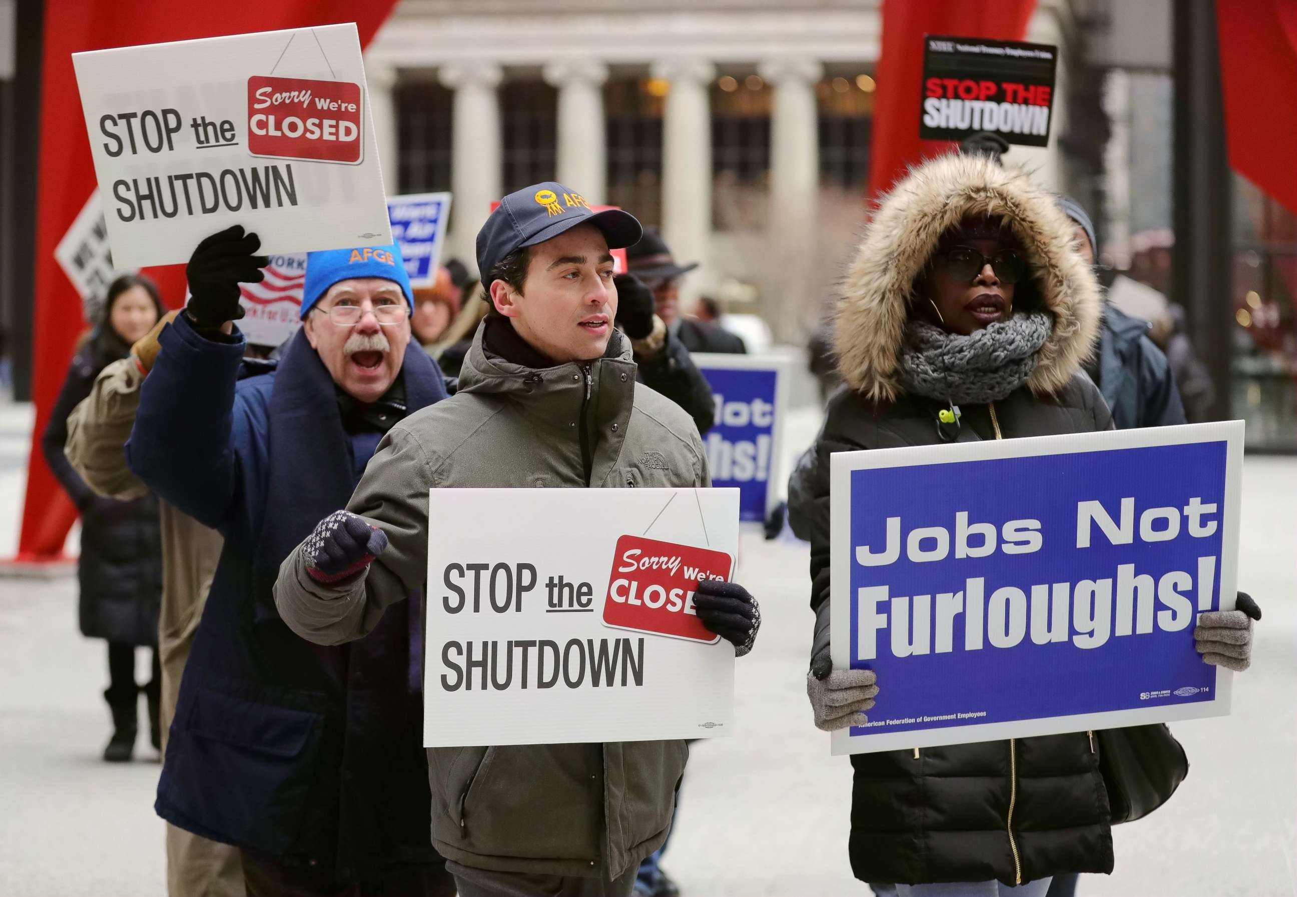 PHOTO: People hold placards during a rally to protest against the partial government shutdown at Federal Plaza in Chicago, Jan. 18, 2019.