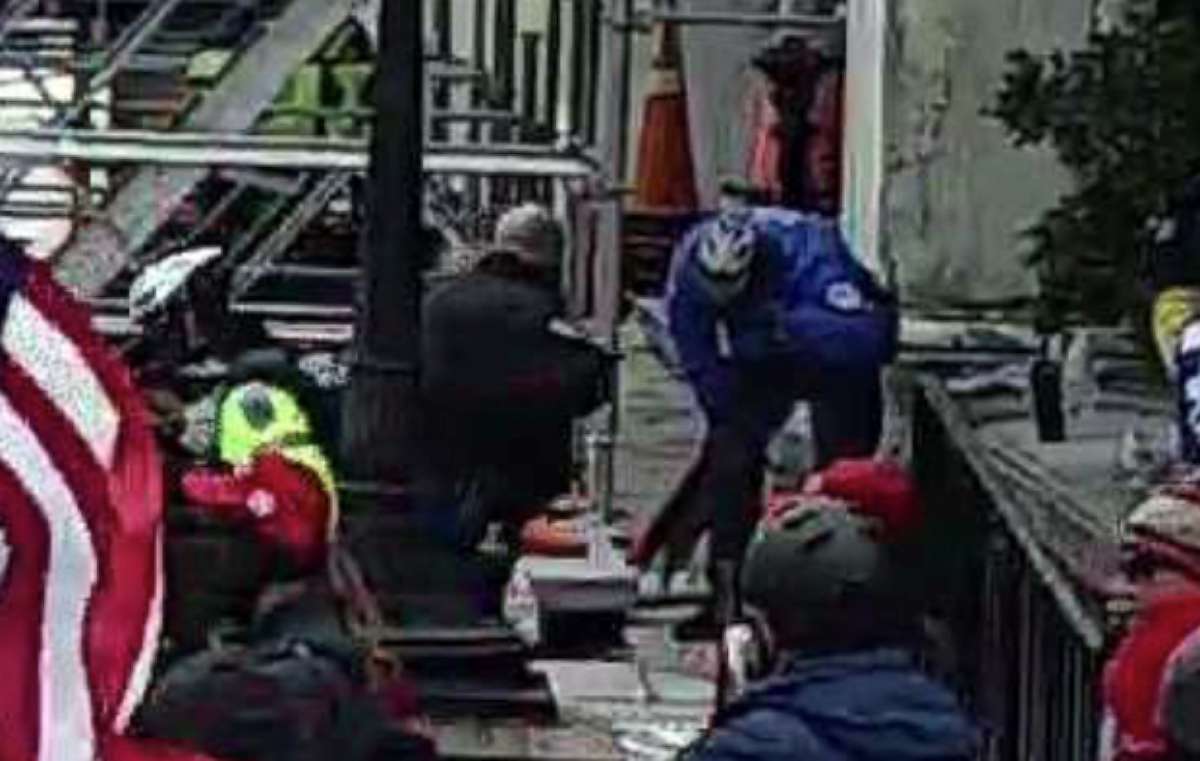 PHOTO: In an image included in an affidavit, the man in the blue coat is named as Capitol Police Officer Brian Sicknick, as he reacts to an irritant being sprayed in his eyes at the Capitol, Jan. 6. 2021.