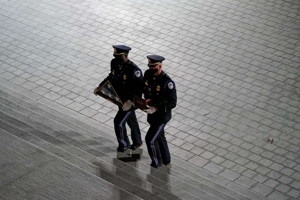 PHOTO: An honor guard carries an urn with the cremated remains of U.S. Capitol Police officer Brian D. Sicknick and a folded flag up the steps of the U.S Capitol to lie in honor in the Rotunda on Feb. 2, 2021, in Washington, D.C.