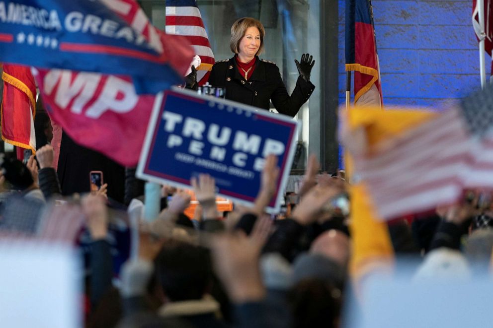 PHOTO: Attorney Sidney Powell waves at attendees at a press conference on election results in Alpharetta, Georgia, U.S., December 2, 2020.  REUTERS/Elijah Nouvelage