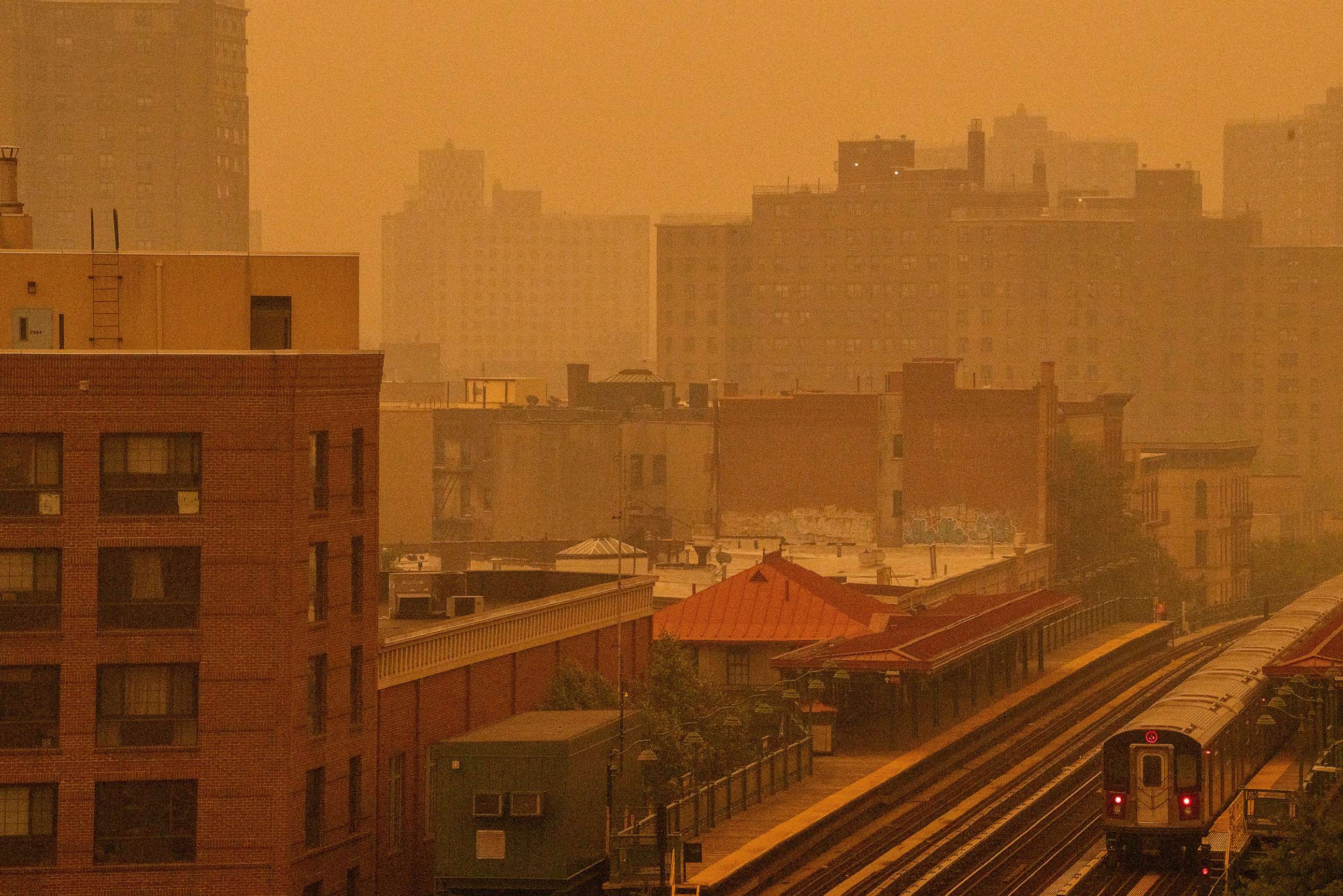 PHOTO: A smoky haze from wildfires in Canada blankets a neighborhood, June 7, 2023, in the Bronx, New York.