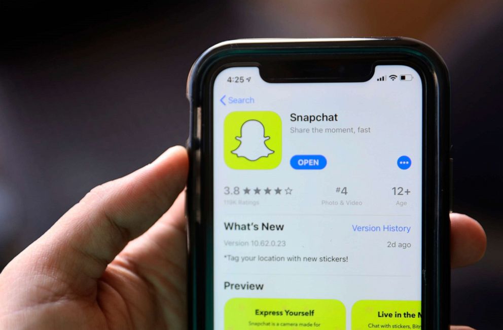 PHOTO: This July 30, 2019, file photo shows an introduction page for Snapchat shown in a mobile phone displayed at Apple's App Store in Chicago.