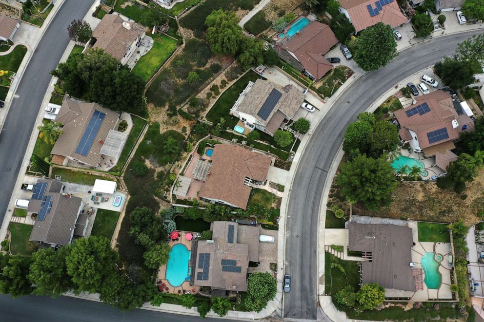 PHOTO: Solar panels are seen on rooftops, in Santa Clarita, near Los Angeles, Calif., June 18, 2020.