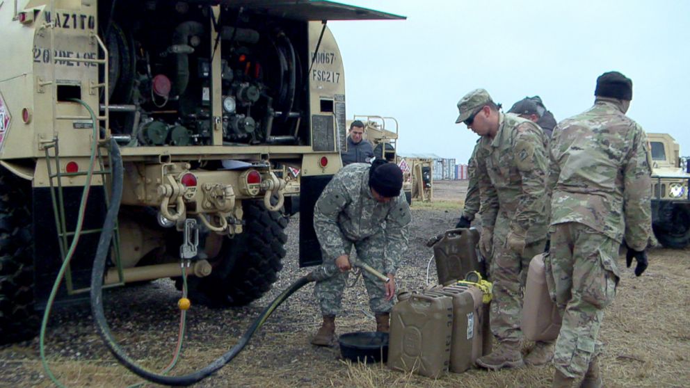 PHOTO: U.S. Army soldiers fuel up gas tanks.