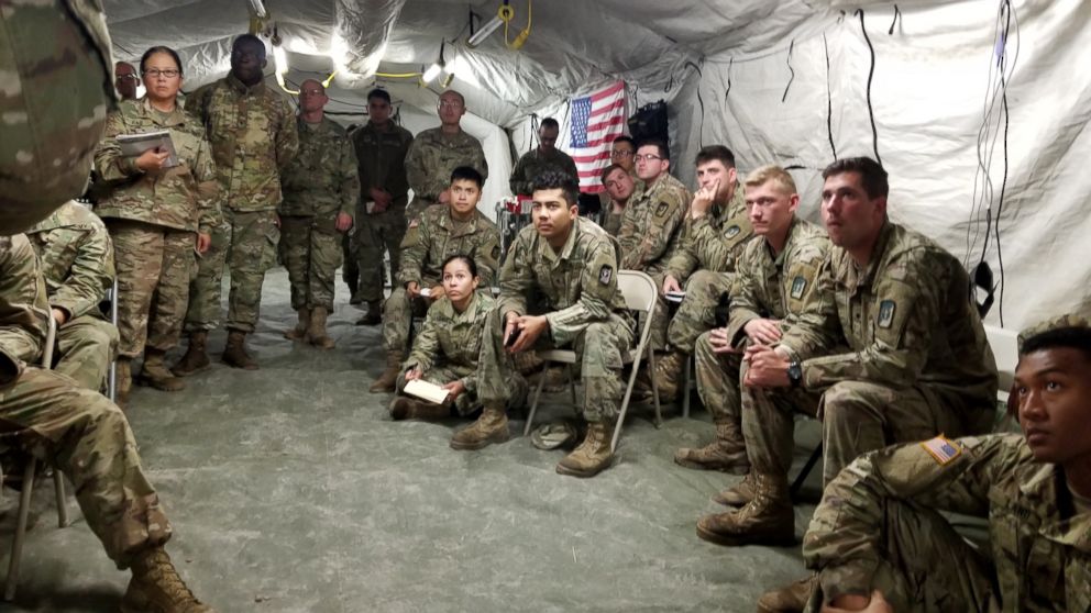 PHOTO: Army soldiers listen to a lecture in a medical clinic tent at Base Camp Donna.