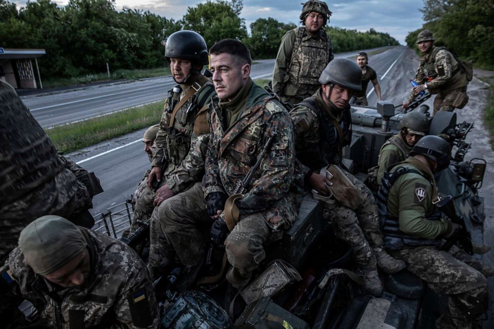 PHOTO: Ukrainian soldiers from the 95th Air Assault Brigade ride on an armored vehicle as they head toward the frontline near the city of Kramatorsk in Ukraine's eastern Donetsk region, May 25, 2022.